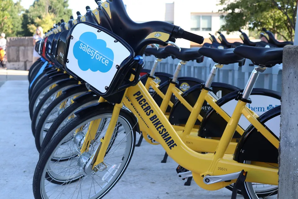 Row of yellow Pacers Bikeshare bikes at station in downtown Indianapolis, Indiana.